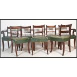 A set of 8 19th century Regency mahogany and green leather bar back dining chairs. Raised on sabre