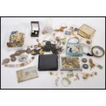 A collection of silver and vintage costume jewellery to include earrings, brooches, rings, coin