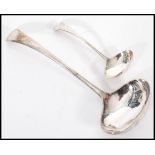 A pair of graduating silver hallmarked ladle's having curved handles. Hallmarked Sheffield, date