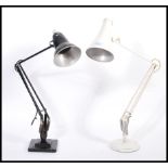 Two vintage retro 20th century industrial desk lamps comprising of a white Herbert Terry