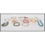 A collection of vintage silver and other bangles and bracelets to include hallmarked examples,