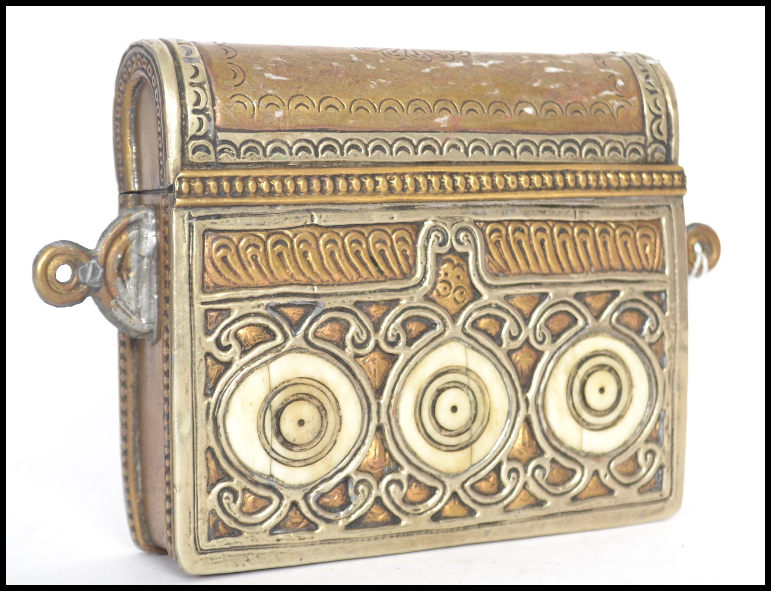 A 19th century Moroccan brass Quran container box. Originally being fastened to a belt with bone