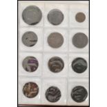 A collection of tokens dating from the 18th - 20th century. British and world approx 87 in folder.
