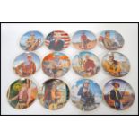 A collection of 12 Franklin Mint Heirloom Collection John Wayne plates to include ' Hondo Lane,