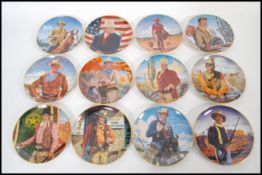 A collection of 12 Franklin Mint Heirloom Collection John Wayne plates to include ' Hondo Lane,