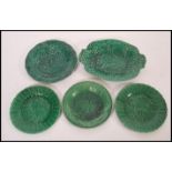 A group of five 19th century Wedgwood majolica plates and tray all having majolica leaf