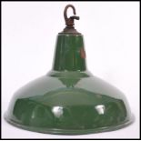 A vintage retro industrial factory green enamelled metal ceiling pendant lamp shade, retaining