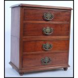A Victorian 19th century table top specimen chest. Raised on bun feet with an upright pedestal /