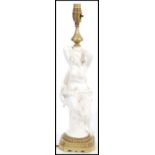 A 19th century Victorian table lamp centerpiece  having a white glazed nude figurine with cherub