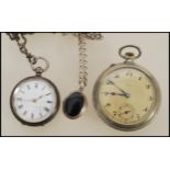 An early 20th century silver continental ladies open faced pocket / fob watch set to an albert chain
