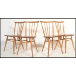 A set of four vintage retro 20th century Ercol beech and elm Windsor model 391 dining chairs