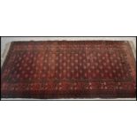 An early 20th century Persian rug  hanging having red ground with geometric decoration. ( reduced in
