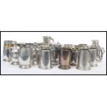 A selection of sporting interest rowing related white metal tankards and goblets, most made from