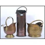 A group of antique fireside items to include two 19th century brass and copper coal scuttle with