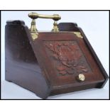 A 19th century Victorian mahogany coal scuttle box retaining the original tin liner. The fall