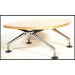 A contemporary / 20th century chrome and maple wood coffee occasional table by Vitra. Raised on