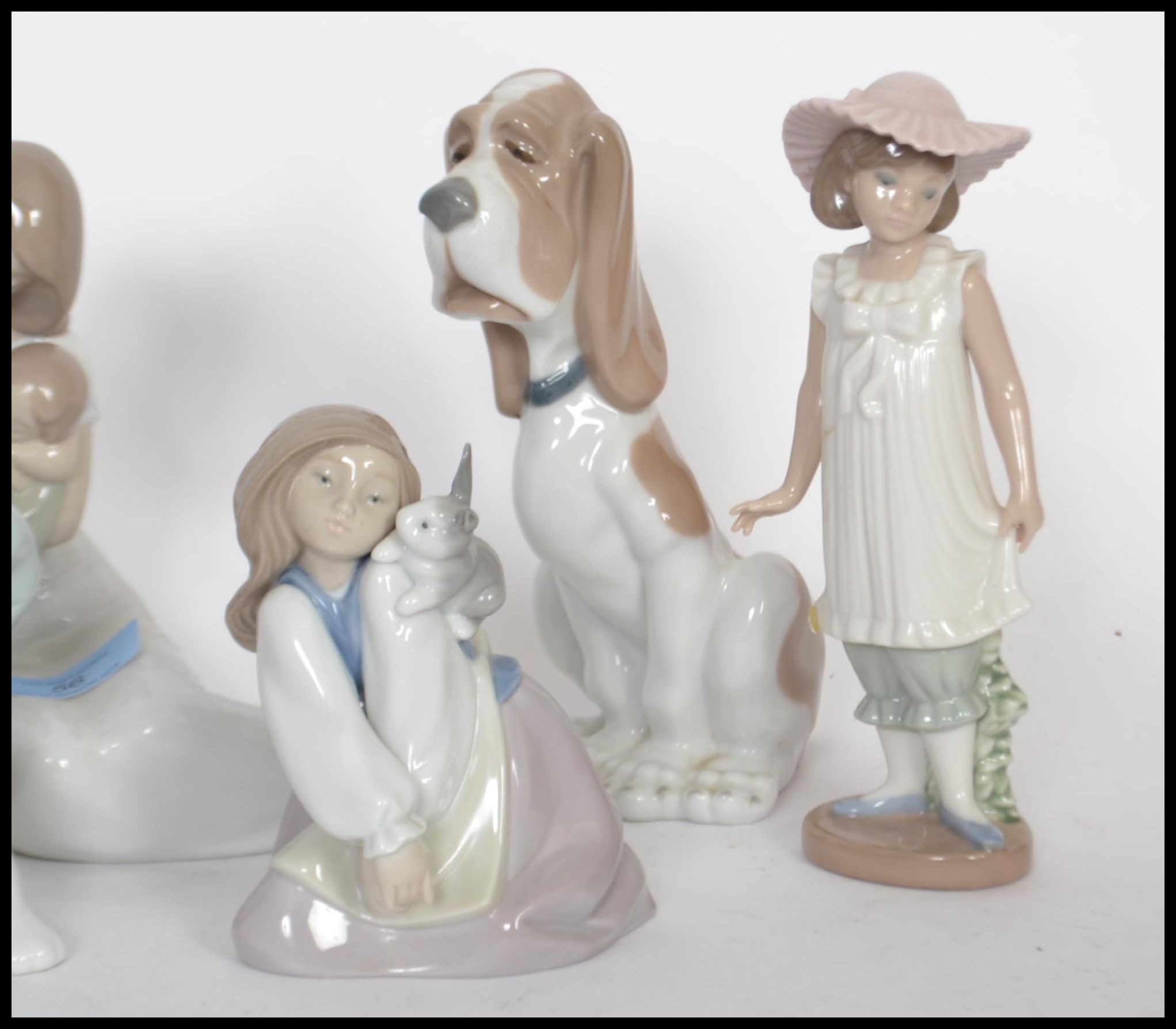 A collection of NAO ceramic figurines to include a mother and child figure, a girl holding a candle, - Image 4 of 5