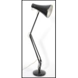 A vintage retro mid 20th century Herbert Terry industrial anglepoise desk lamp raised on circular