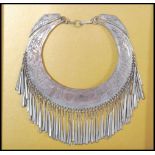 An early 20th Century Thai hill tribe ceremonial silver white metal collar necklace having