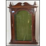 A 19th century Victorian mahogany wall mounted display cabinet / notice board having swan pediment