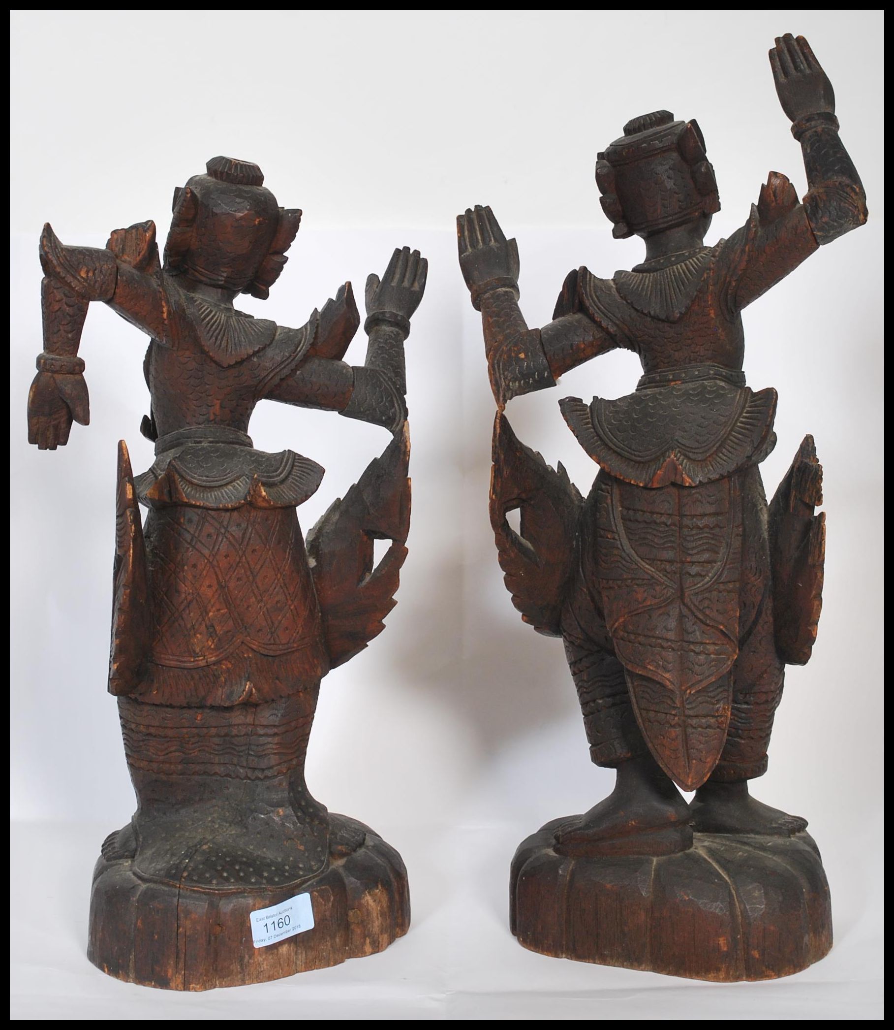 A pair of early 20th century Chinese / Asiatic wooden hand carved figurines of Buddhas / deities - Image 4 of 4