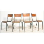 A set of 4 mid 20th century retro tubular metal and plywood stacking chairs - dining chairs of