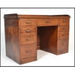 A vintage 20th Century Air Ministry oak twin pedestal desk, the top with inset scribe and gallery