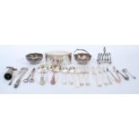 A collection of silver plated wares to include lozenge shaped box, grape scissors, toast rack,
