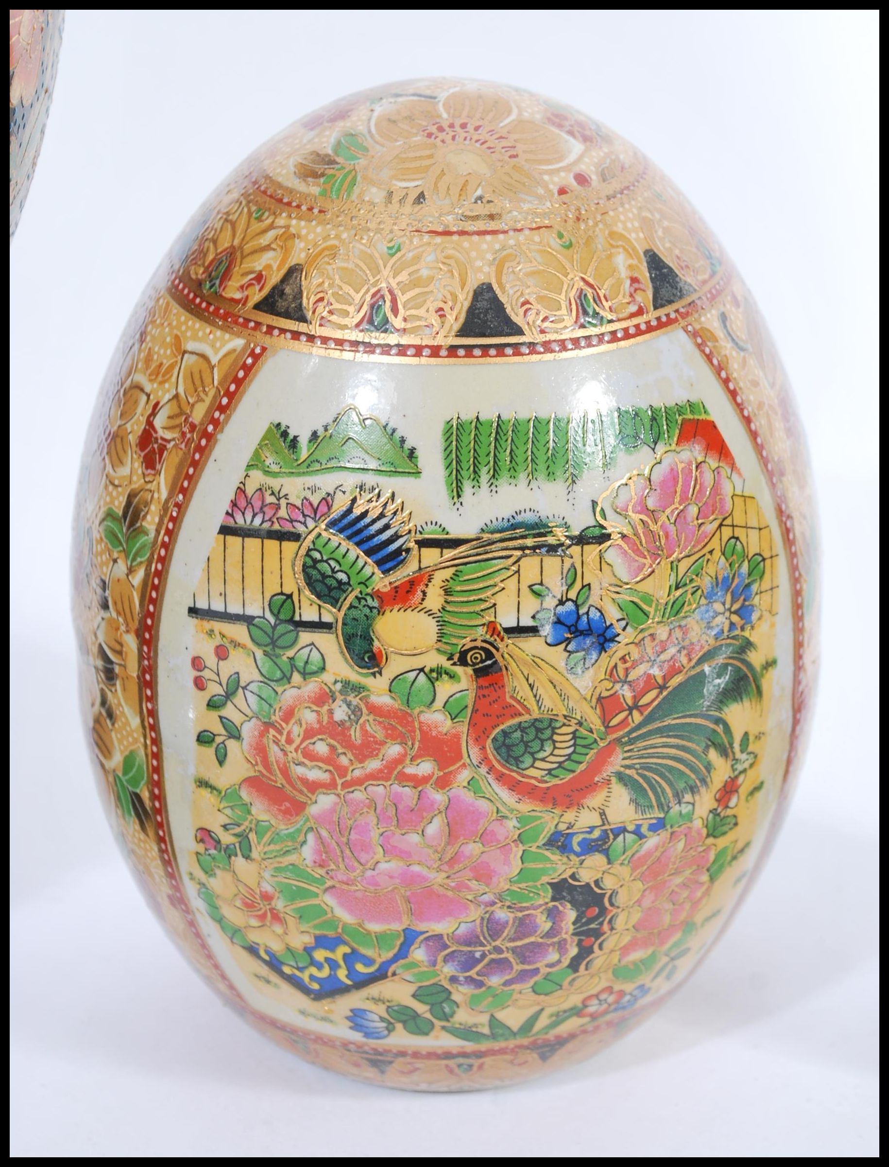 A group of three vintage 20th century Japanese ceramic eggs to include a large example on ebonised - Image 3 of 6