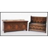 A 20th century apprentice piece Jacobean hall settle music box having carved details together with a