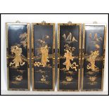 A set of vintage 20th Century four Chinese lacquer wall plaques of rectangular form, having gilt