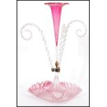 A 19th Century Victorian cranberry glass epergne table centre piece, upright cranberry tulip