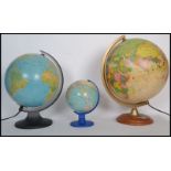 A group of three retro vintage 20th century terrestrial desk globes to include two illuminated