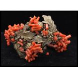 A vintage Frank Hess / Miriam Haskell spezzati coral coil bracelet having gold tone thistle