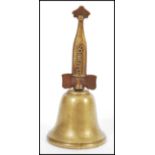 A vintage 20th century advertising countertop bell for Schweppes and Co with brass finial handle.