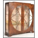 A large early 20th Century 1930's Art Deco mahogany display cabinet raised on block feet with