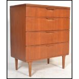 A vintage retro 20th century teak chest of drawers by Austin Suite raised on cylindrical tapered