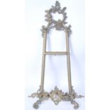 A 19th century Victorian gilt brass table stand / wall mounted picture holder of scrolled form.
