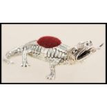 A stamped 925 silver pincushion in the form of a lizard with a forked tongue having a red cloth