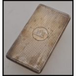 A silver hallmarked sprung calling card case, machine turned case with central cartouche having a