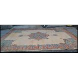 A large early 20th Century circa 1930's Ushak full pile wool floor rug believed to have been