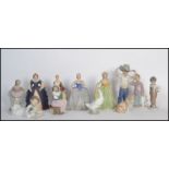 A selection of nao ceramic figurines to include a boy and teddy bear figurine, a boy in a cowboy