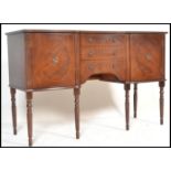 An 20th Century Regency revival mahogany veneered sideboard having brass ring handles and a