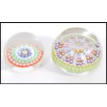 Two 20th Century paperweights to include a smaller glass domed paper weight with a coloured