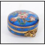 A 19th century Chinese cloisonne pill pot box on pendant bale hoop. Deep blue ground with decoration
