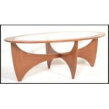 A retro mid 20th century teak wood atomic ' Astro ' lozenge shaped coffee table by G Plan, having