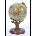 A vintage retro mid 20th century 1940's tin desk top globe raised on a circular base. Measures