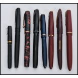 A collection of vintage 20th Century assorted fountain pens, each fitted with a nib marked 14K, to