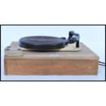 A vintage early 20th century Garrard Model T&M Mk II record deck set to a wooden base, the turntable