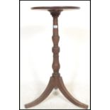 An 18th century George III mahogany wine table. Of tripod form with splayed legs, turned column